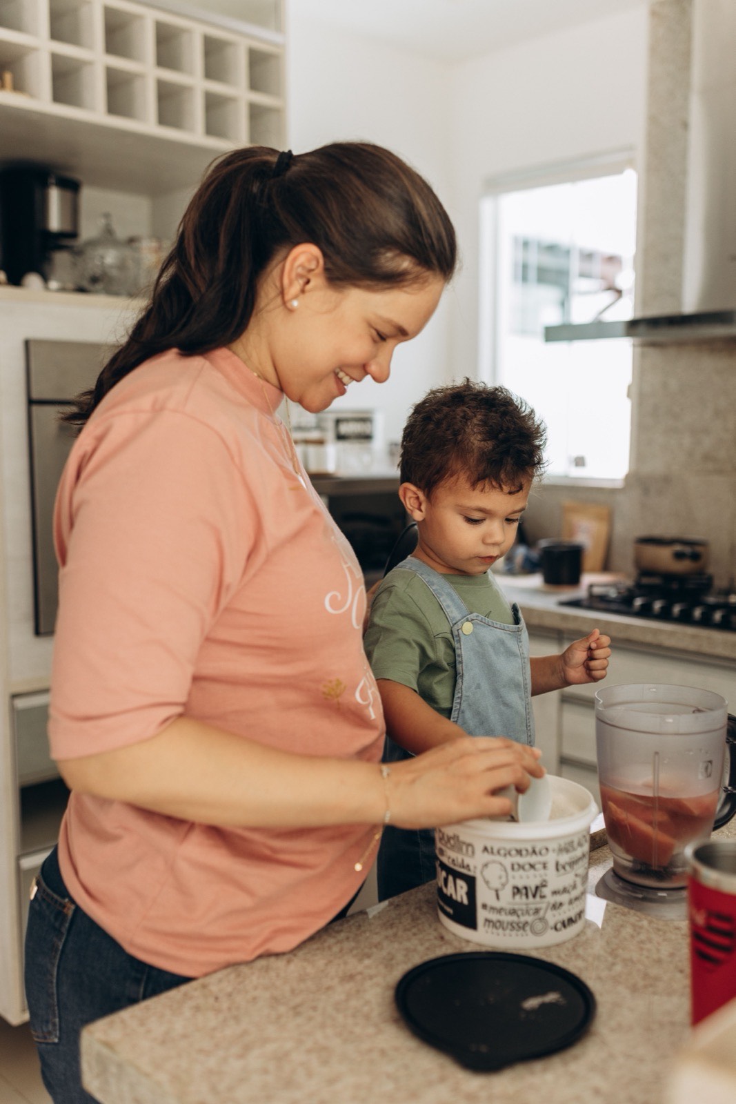 Woman and toddler at a kitchen counter